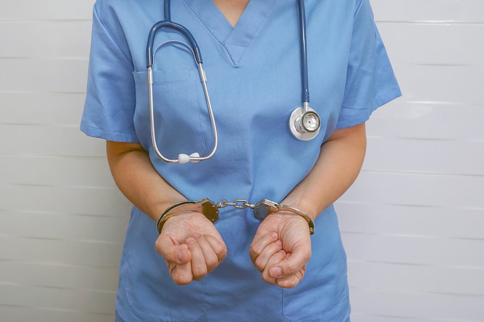 Woman doctor handcuffed. Bribe